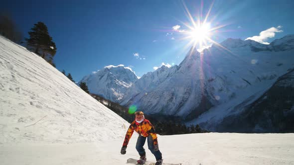 Happy Snowboarder Showing Tricks on Ski Slope and Showing Thumbs Up