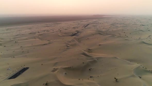 Aerial abstract view of road covered by sand in the desert, Abu Dhabi, U.A.E.