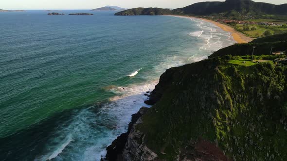 Ocean waves rolling into beautiful natural coastline, Geriba beach, Buzios, Brazil