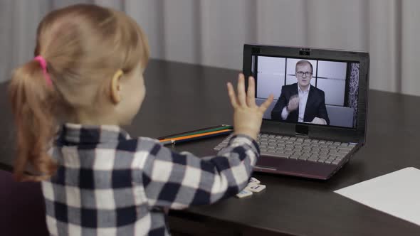 Girl Pupil Distance Education Lesson with Teacher, Using Digital Laptop at Home