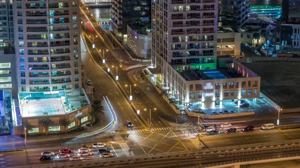 Aerial View of a Road Intersection in a Big City Night Timelapse