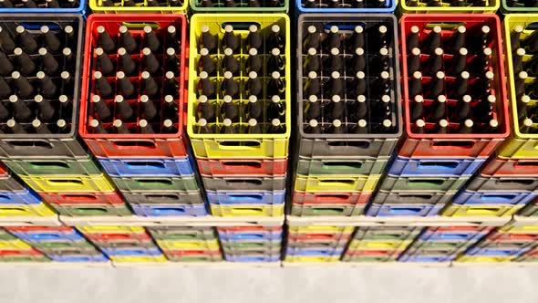 Loop of countless colorful beer crates stacked in an outdoor warehouse. 4KHD