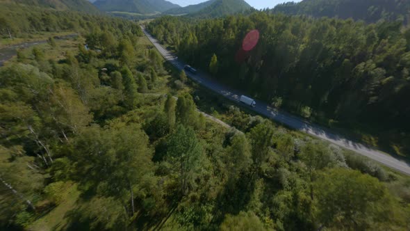 Aerial View Asphalt Road Highway with Transportation Traffic Greenery Mountain Valley Forest River