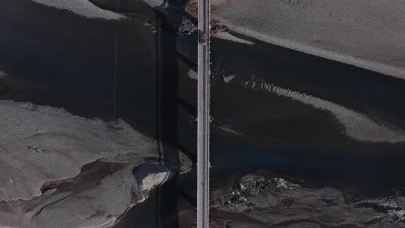 Drone Over Car Crossing Bridge Over Hvannagil Estuary