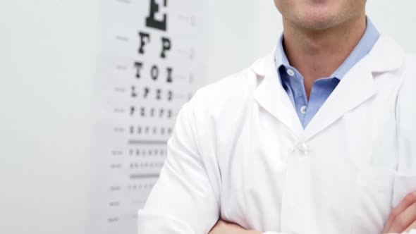 Optometrist standing in ophthalmology clinic