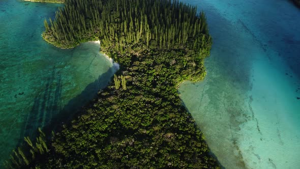 The small Ile Mwareya is part of the Isle of Pines in New Caledonia - aerial flyover