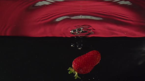Strawberry Drop Into Water in Slowmotion