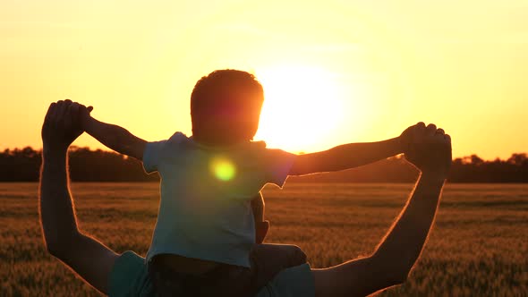 Silhouette of a Family at Sunset