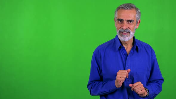 Old Senior Man Talks To Camera - Green Screen - Studio