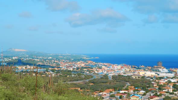 Zoom in from above, View of Willemstad, Curacao along Sint Anna Bay, Caribbean