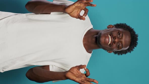 Cheerful Person Doing Okay Symbol with Hands