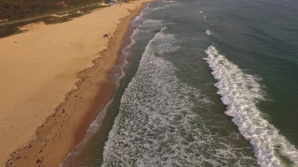 Aerial Drone View of Tropical Beach Ocean Waves Reaching Shore