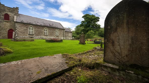 Motion time lapse of local historical Church of Ireland graveyard in rural country of Ireland during