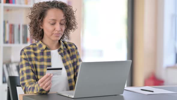 Online Shopping Loss on Laptop By Young Mixed Race Woman 