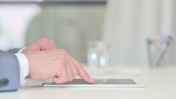 Hands Close Up of Businessman Working on Tablet
