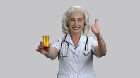 Old Female Doctor Recommends Can of Pills