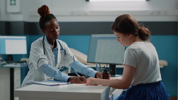 Patient Receiving Medical Treatment From Doctor at Checkup