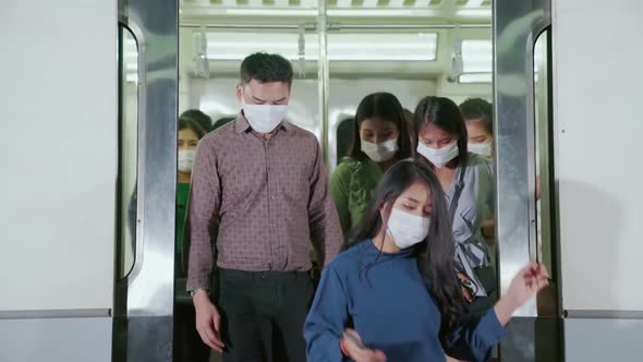 Crowd of People Wearing Face Mask on a Crowded Public Subway Train Travel