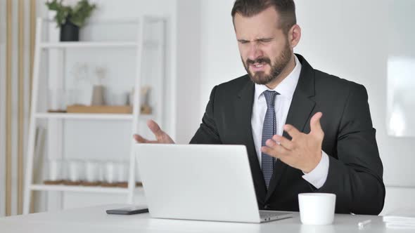 Loss, Frustrated Businessman Working on Laptop