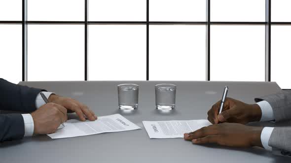 Businessman Signs a Contract.