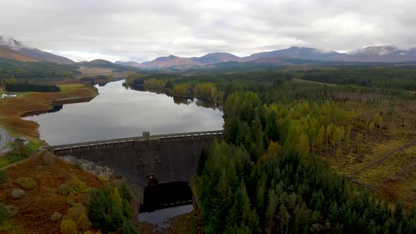 Aerial view of Laggan dam artificial lake and beautiful countryside and wood