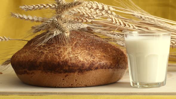 Freshly baked homemade hot bread and milk.