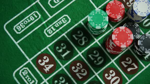 Casino chips on roulette on poker table