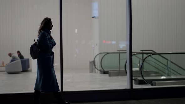 Woman are Going to Underground Station Walking in City After Work Silhouette of Tired Lady