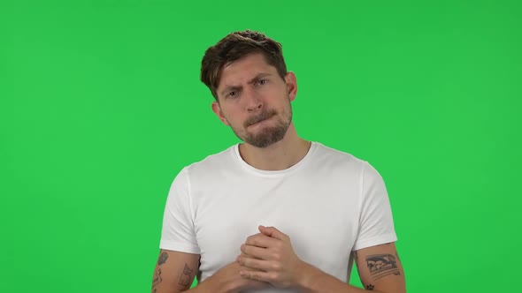 Portrait of Confident Guy with Anger Is Looking at the Camera. Green Screen