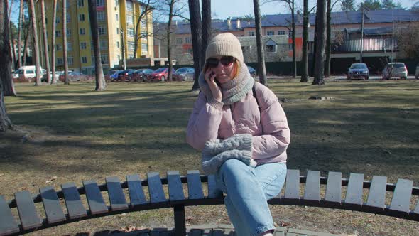 Woman Calling On The Phone In The Park