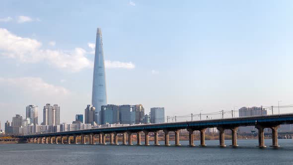 Timelapse River Flows Under Thick Traffic on Seoul Bridge