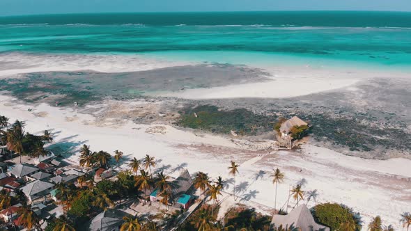 The Rock Restaurant in Ocean Built on Stone at Low Tide on Zanzibar Aerial View