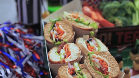 Football Snack Stadium filled with sub sandwiches, veggies and chips.