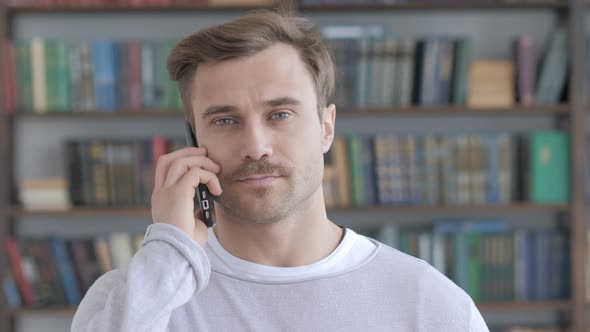Portrait of Adult Man Talking on Phone