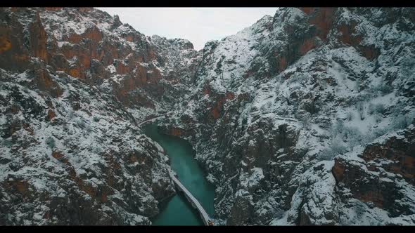 aerial view of train ride between two mountains