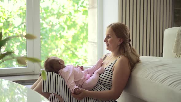 White Woman and Ablack Child Love to Play By Window Spbd