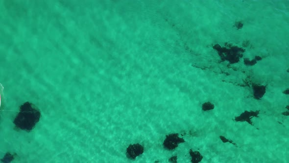 Aerial Panoramic View of Seascape with Crystal Clear Azure Sea and Rocky Shores