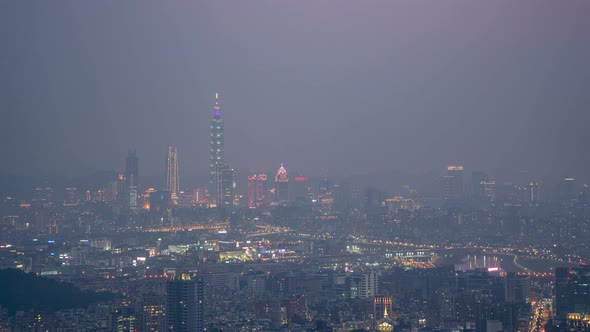 Distance View of Day to Night Time Lapse of Taipei 101 with air pollution thick smog, overlooking bu