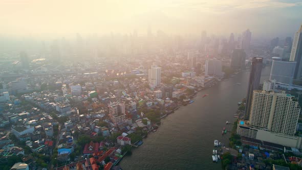 4K : Drones fly over the Chao Phraya River, buildings and business districts