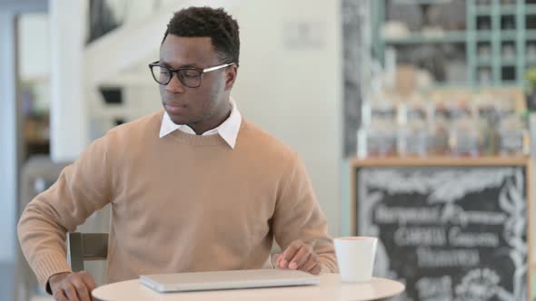 Creative African Man Closing Laptop Standing Up Going Away