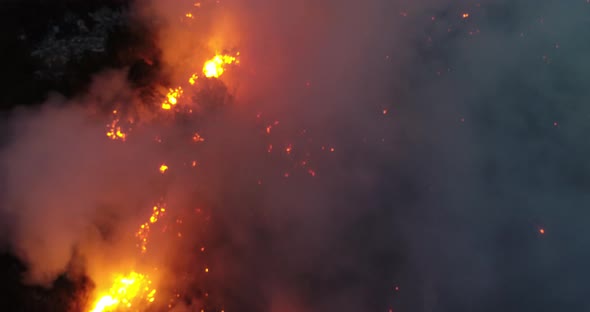 Aerial Panoramic View of a Forest Fire at Night Heavy Smoke Causes Air Pollution and Fire in Full