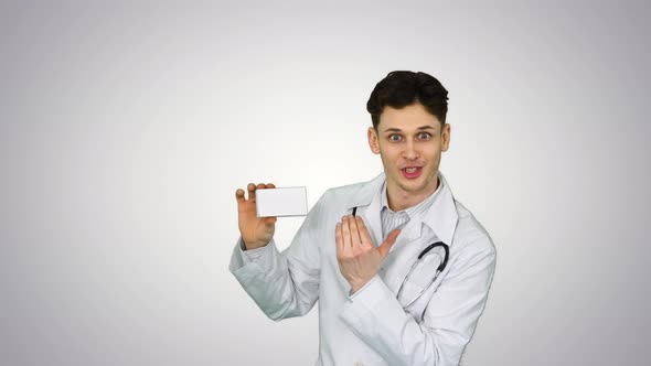 Young Doctor Presenting New Pills and Dancing on Gradient Background.