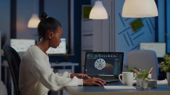 African Woman Engineer Working in Modern Cad Program with Gear