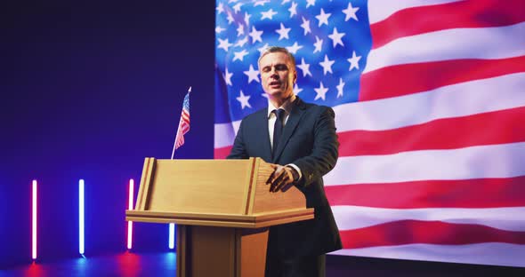Presidential Candidate Giving Speech Against USA Flag