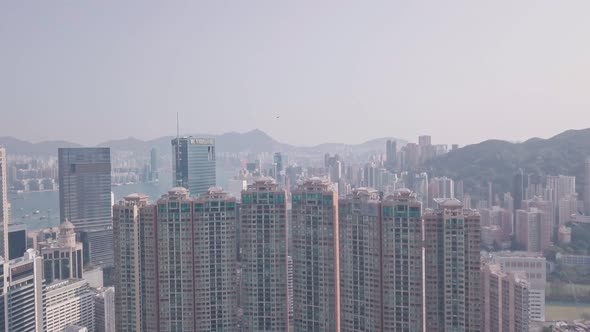 Residential buildings and skyscrapers in Happy Valley, Hong Kong. Aerial drone view