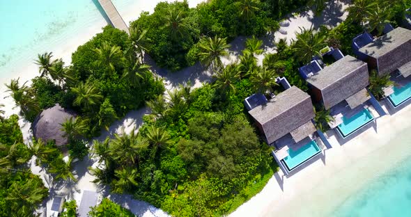 Natural birds eye abstract shot of a white paradise beach and blue water background in colorful