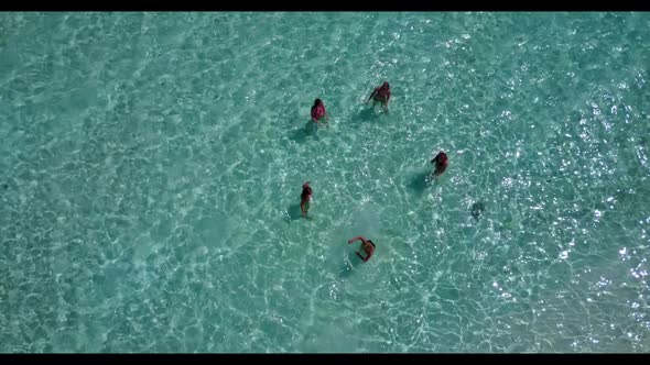 Beautiful women sunbathing on exotic sea view beach holiday by blue water with clean sand background