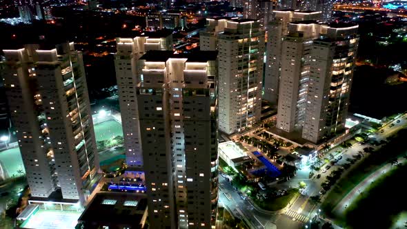 Night city landscape at downtown district. Buildings and traffic.