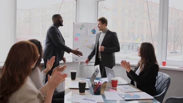 the Leader's Entry to the Applause of the Employees in the Office