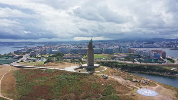 Tower of Hercules oldest lighthouse with seaside cityscape. Aerial